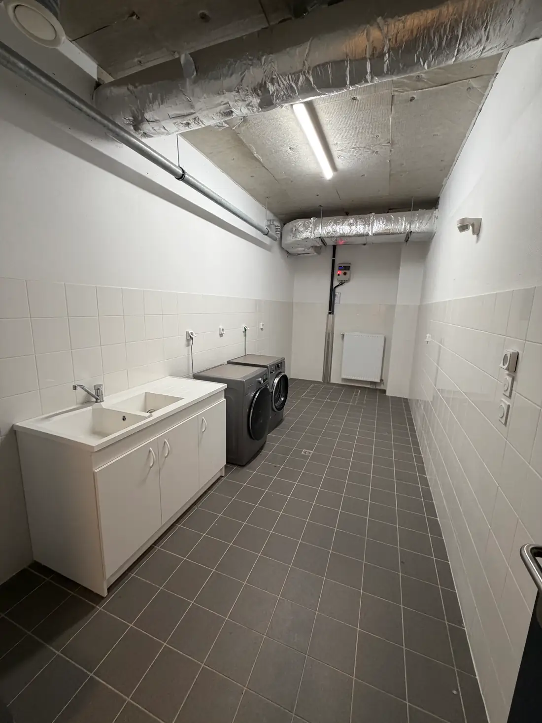 Buanderie partagée de la résidence Impul'S à Rennes avec lave-linge et sèche-linge